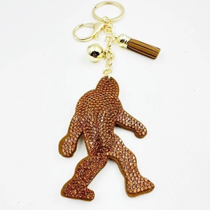 Sparkling rhinestone ape keychain with brown leather tassel and gold plating for handbags