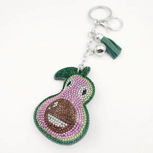 Sparkling crystal avocado keychain with pink rhinestones and a dark green tassel