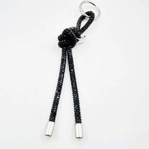 Luxurious black rhinestone knotted keychain with silver metal ring and polished end caps