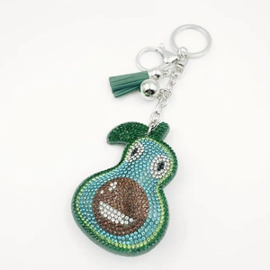 Cute cartoon avocado keychain with sparkling crystals and a green silk tassel
