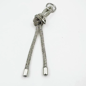 Silver rhinestone phone chain with sparkling metal knots and a polished heart charm