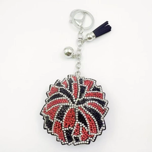 Porte-clés cœur à strass motif feu d'artifice avec pompon noir et clochette argentée