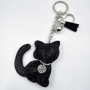 Sparkling black rhinestone cat keychain with leather tassel and silver bell accessory