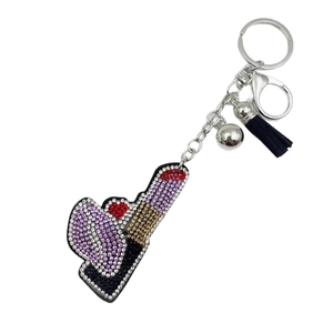 Portachiavi a forma di rossetto in velluto con strass e nappa in pelle blu scuro