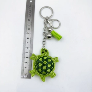 Porte-clés tortue en strass verts avec pompon et clochette pour sacs à main