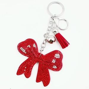Red bow rhinestone keychain with crystal polka dots, silver bell and velvet tassel