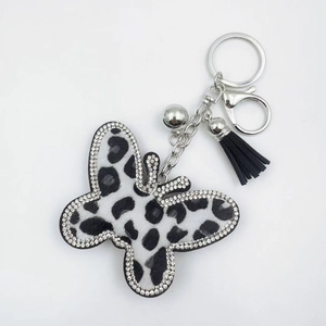 Sparkling leopard print butterfly keychain with black tassel and crystal accents