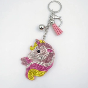 Pink rhinestone unicorn keychain with tassel and bell accessory for handbags