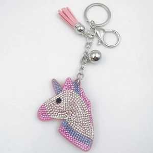 Sparkling pink unicorn keychain with crystal rhinestones, tassels and silver metal ring