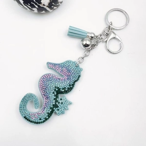 Sparkling seahorse keychain with gradient crystals, silver lobster clasp, and blue tassel