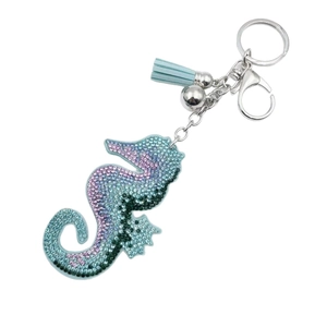 Sparkling seahorse rhinestone keychain with blue leather tassel and crystal gradient accents