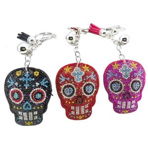 Skull keychains with colorful rhinestones and tassels in black red and purple set