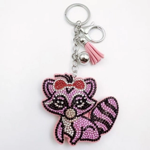 Porte-clés raton laveur en strass rose avec pompon et clochette pour sacs à main