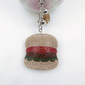 Sparkling rhinestone burger keychain with khaki tassel and bells on a silver chain
