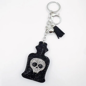 Sparkling gothic skull perfume bottle keychain with black rhinestones and tassels