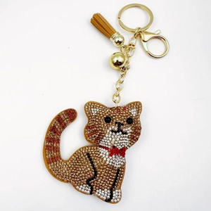 Sparkling crystal cat keychain with brown tassels and golden bell for handbag decoration