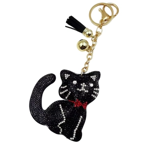 Sparkling crystal cat keychain with black rhinestones, golden hardware, and black tassel