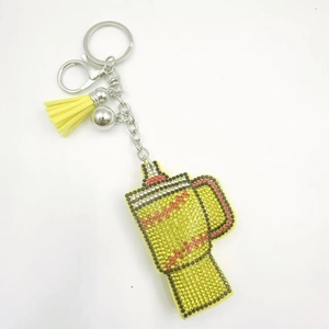 Creative cup-shaped rhinestone keychain with yellow tassels and sparkling crystals