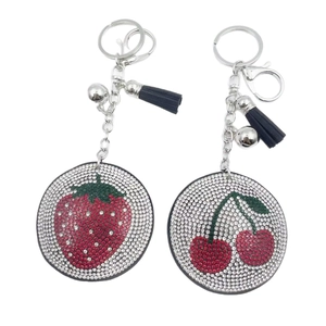 Fruit themed rhinestone strawberry and cherry keychain with black leather tassel and bell
