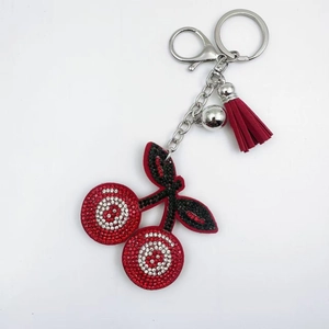 Sparkling rhinestone cherry keychain with burgundy tassel and silver bell for bag decor