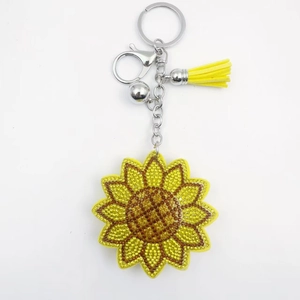 Porte-clés tournesol scintillant avec strass, pompon en cuir jaune et fermoir argenté