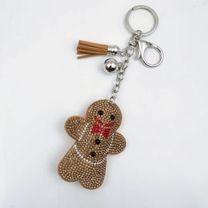 Sparkling gingerbread man keychain with rhinestones, brown tassel and silver bell