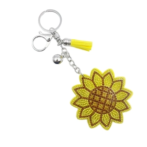 Porte-clés tournesol scintillant avec strass jaunes, pompon frangé et clochette argentée