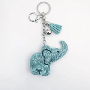 Porte-clés éléphant bleu clair avec cristaux, pompon en cuir et clochette argentée