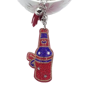 Crystal studded wine bottle keychain with colorful rhinestones and decorative tassel
