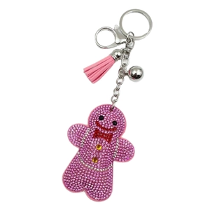 Sparkling pink rhinestone gingerbread man keychain with tassel and silver bell pendant