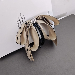 Polka dot ribbon banana clip with sparkling rhinestones for elegant hair styling
