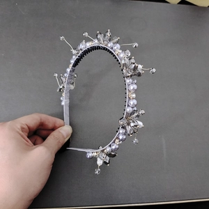 Floral headband with grey crystals and purple pearls on a vintage black metal band