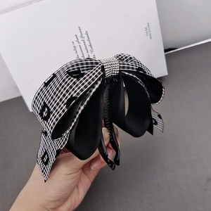 Elegant banana hair clip with rhinestones and black and white check pattern bow