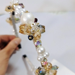 Detail view of handcrafted luxury headband with pearls, crystals and wire-wrapped design