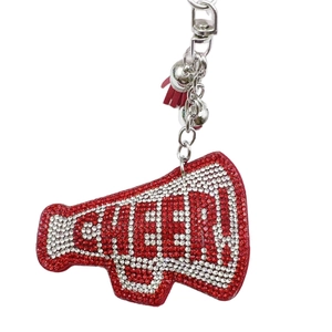 Sparkling crystal megaphone keychain with CHEER letters and red tassel accent