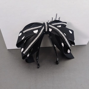 Polka dot bow banana hair clip with rhinestones for elegant ponytail styling