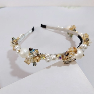 Elegant luxury headband with handmade pearls and sparkling crystals on a silk fabric base