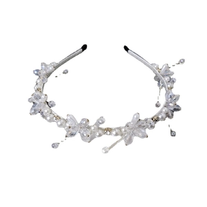 Elegant silver headband with clear crystals and white pearls in a floral vine design