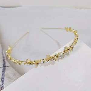 Elegant gold headband with rhinestone flower leaf design for a sweet fairy style look