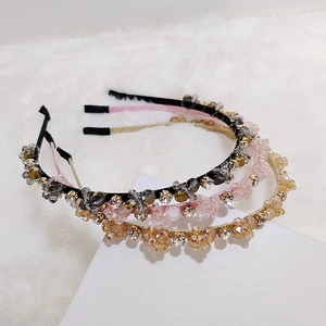 Three pieces of handmade woven crystal headbands in black, pink, and champagne gold colors