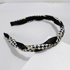 Classic houndstooth headband with black satin weaving and sparkling rhinestone accents
