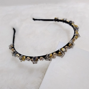 Handcrafted crystal beaded headband with vintage rhinestones on a slim black frame