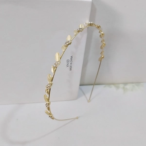 Serre-tête élégant à feuilles dorées avec pierres œil de chat et strass brillants