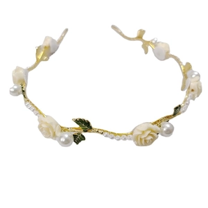 Vintage rose and pearl headband with gold branch design for an elegant hair look