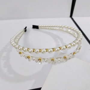 Double-layered pearl and flower headband with gold metal base and rhinestones