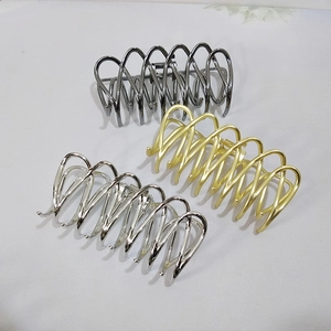 Three-piece metal hair claw clips in silver, gold, and gunmetal grey with wave design