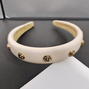 Thick camellia headband in beige leather with golden floral ornaments for women