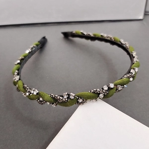 Elegant olive green twisted headband with rhinestone chain and fabric cord detail
