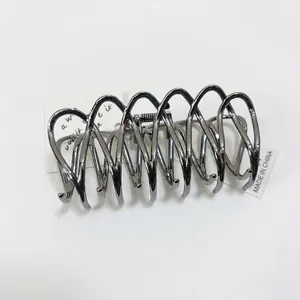 Elegant silver metallic hair claw clip with minimalist spiral design for women's hairstyle