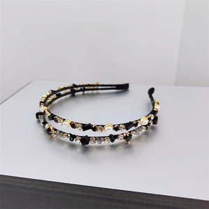 Detail of double-row crystal headband with white pearls and rhinestones in gold setting